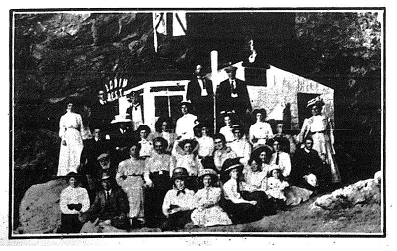 Weekend cave dwellers gather outside 'Pilgrim's Rest', the cave belonging to Osborn. Source: Weekly Press, 12 April, 1911, page 40. Image: Christchurch City Libraries.